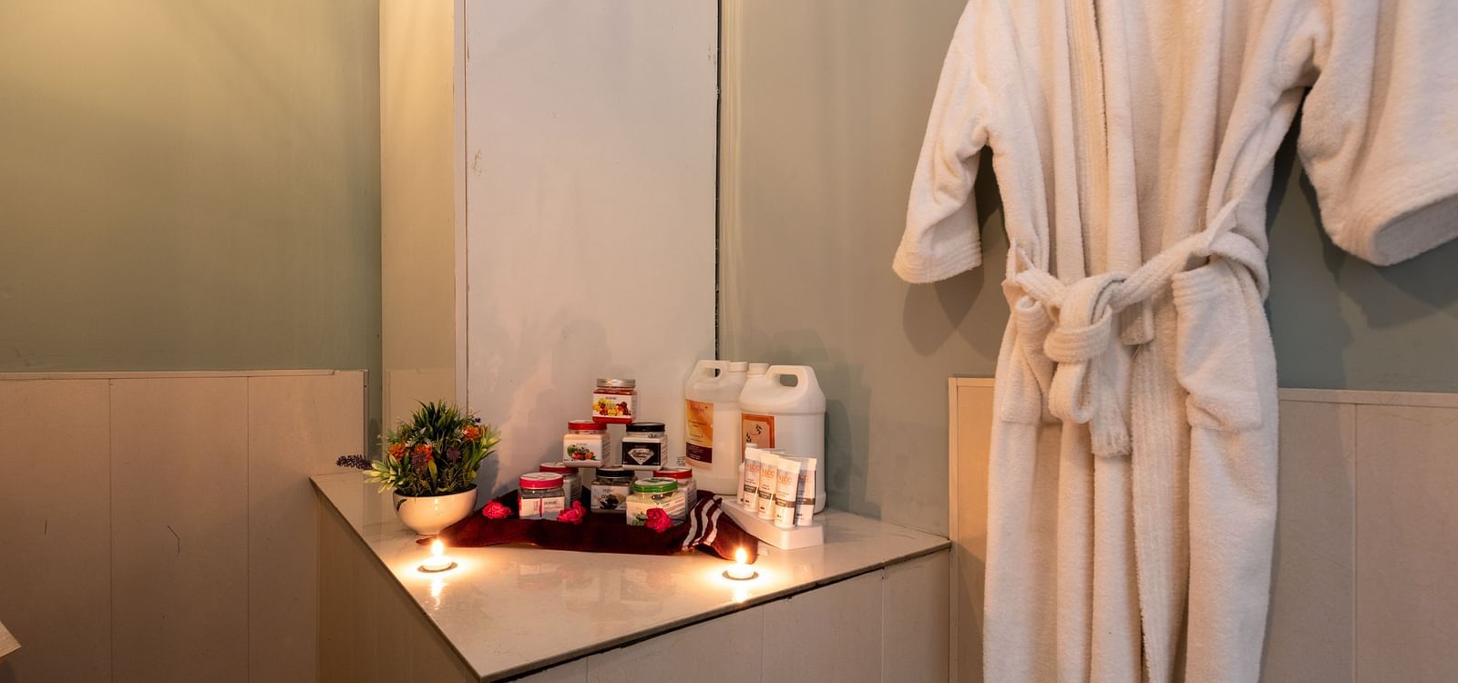 View of essentials placed next to bathrobe at DLS Highland Resort and Spa, Mussoorie.